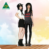 Two women posing together with a colorful background and 'Australian Made' logo.